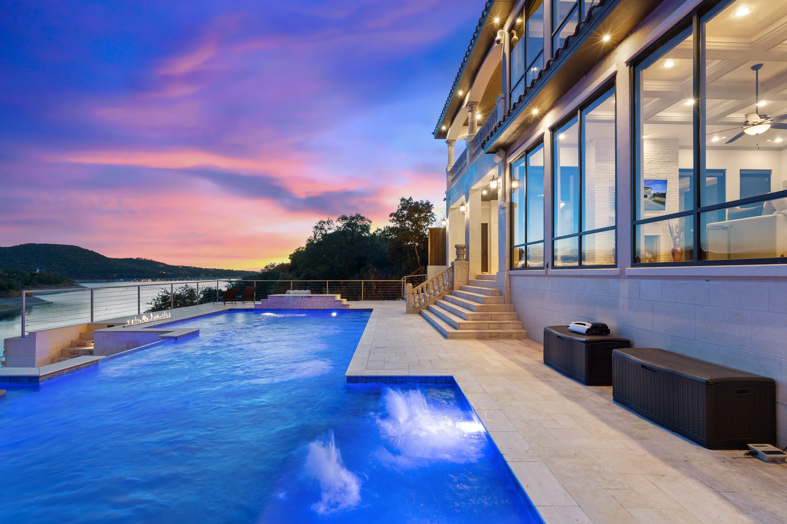 Twilight over the infinity pool and Lake Travis at 17011 E Darleen Dr